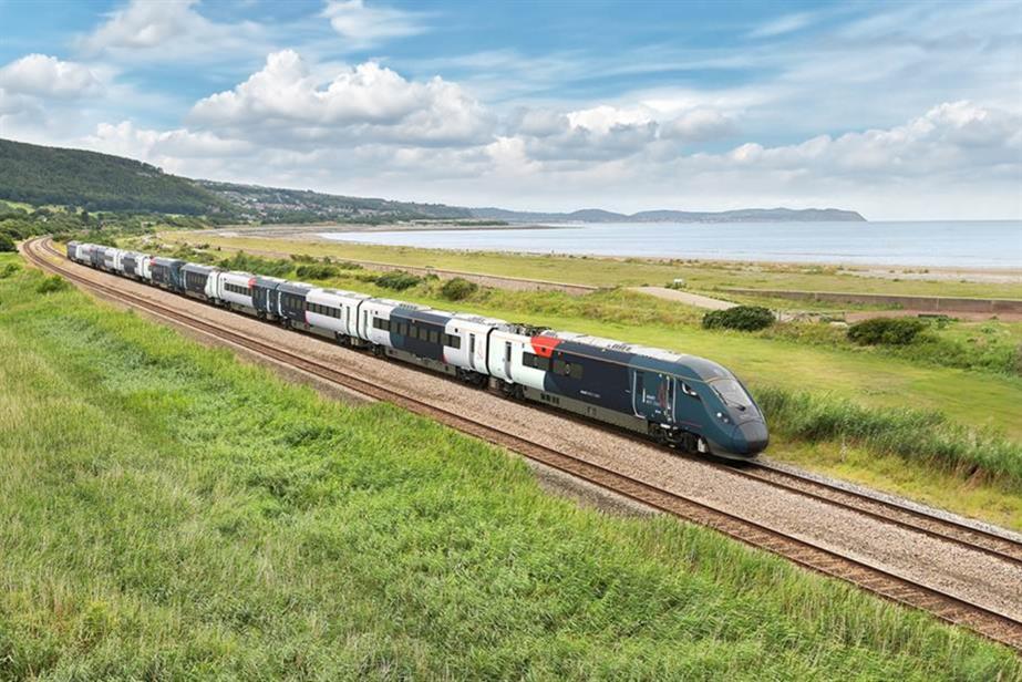 An Avanti West Coast train driving along the coast.
