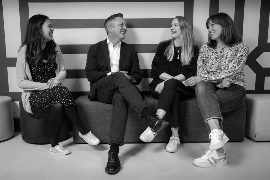 Image of four members of OMD team