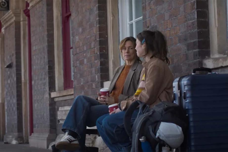 Mother and daughter at train station