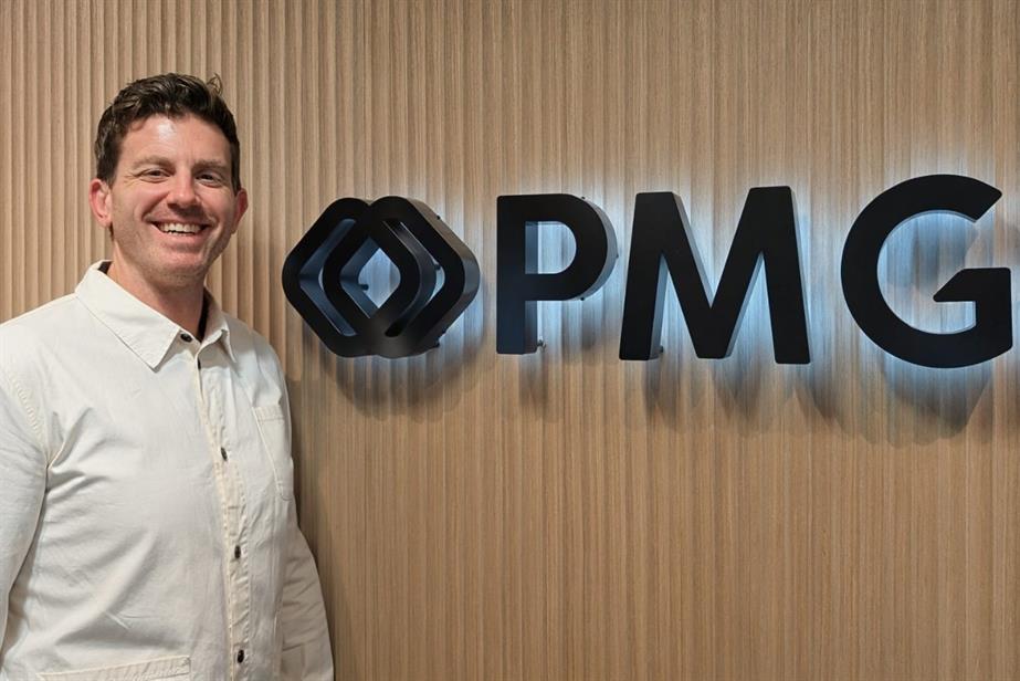Matt Dailey in front of PMG logo.