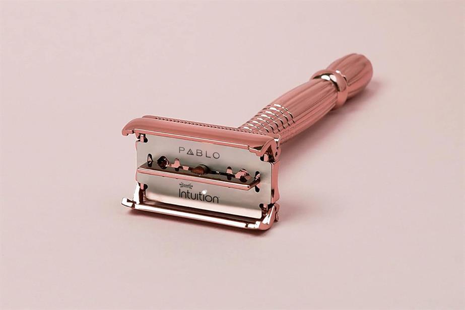 A pink razor with the words Pablo and Intuition